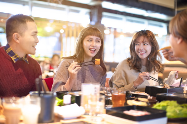 happy asian young Group eating in the restaurant